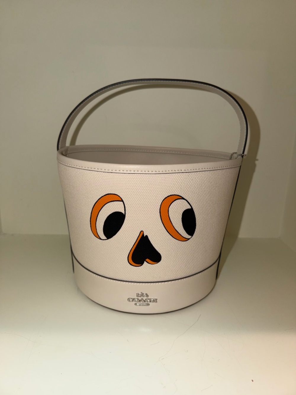 Coach Cream Leather Bucket Bag with Whimsical Orange & Black Face